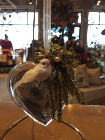 Heart shaped crystal christmas ornament with small greenery bouquet and white dove.  Fabric ribbon as a hanger.