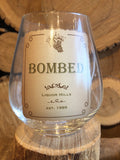 Stemless Wine Glass with vintage label that says "Bombed"