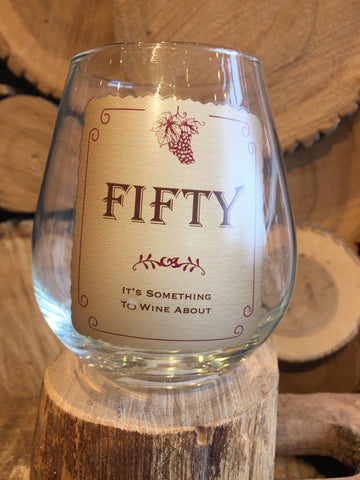 This Stemless Wine Glass inscribed with "FIFTY - It's Something To Wine About"