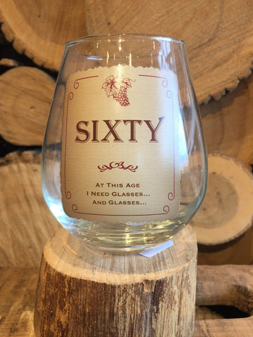 This Stemless Wine Glass inscribed with, "SIXTY - At this Age I need Glasses...and Glasses